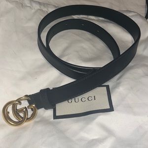 Thin, classic, black Gucci belt with gold hardware